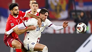 Switzerland's Eray Comert, left, and Serbia's Dusan Vlahovic in action during the UEFA Nations League soccer match between Switzerland and Serbia in Zurich.