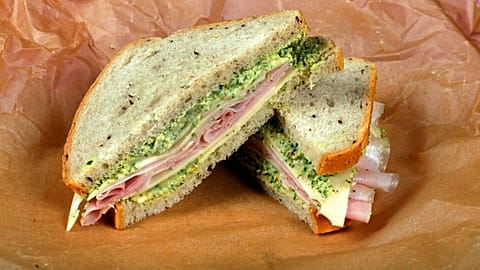 File: This photo shows a ham and cheese sandwich with green spread, styled by Sarah Abrams, displayed at the Institute of Culinary Education in New York, US, 4 August, 2016.