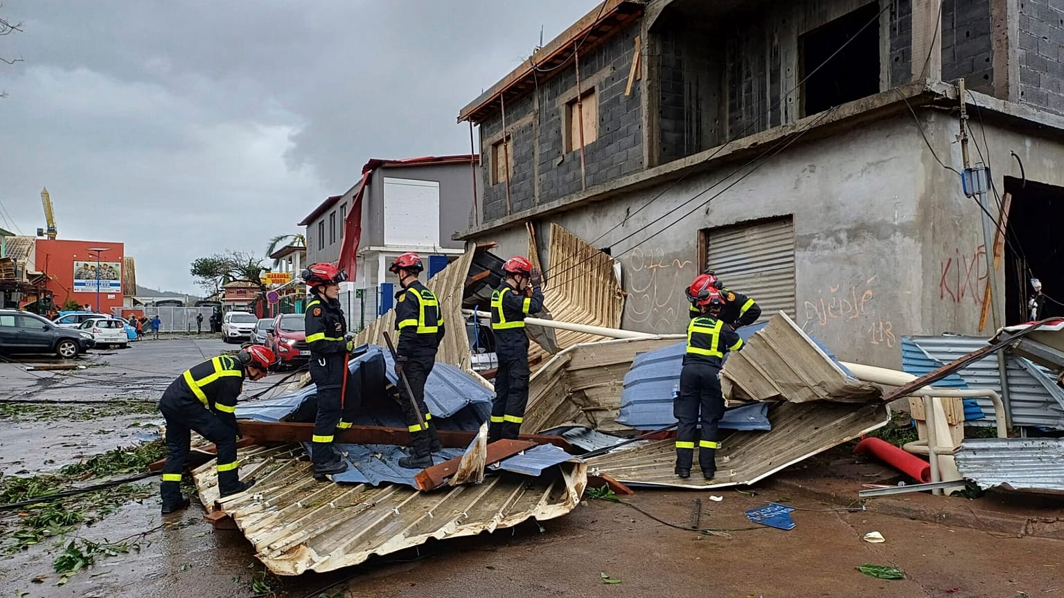 Rescue workers clearing an area in Mayotte after Cyclone Chido caused extensive damage with reports of several fatalities, 14 December, 2024