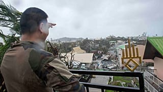 A soldier observes the damage on the French territory of Mayotte in the Indian Ocean, following the passage of cyclone Chido, in Mayotte on 15.12.2024
