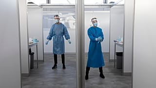 Medical staff wait for the next in line for a COVID-19 test in the Netherlands in 2020.