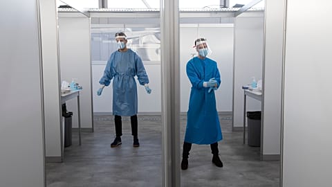 Medical staff wait for the next in line for a COVID-19 test in the Netherlands in 2020.