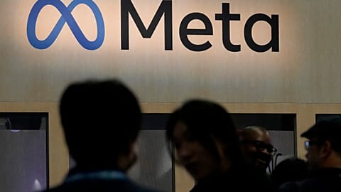 FILE - Attendees visit the Meta booth at the Game Developers Conference 2023 in San Francisco on March 22, 2023