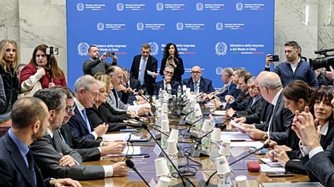 Executives from Stellantis and economic, labor and economic development ministers sit during a meeting held at the Ministry of Enterprise and Made in Italy in Rome.