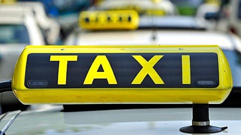 FILE - In this June 15, 2009 file photo taxi cabs are seen at Tegel Airport in Berlin, Germany