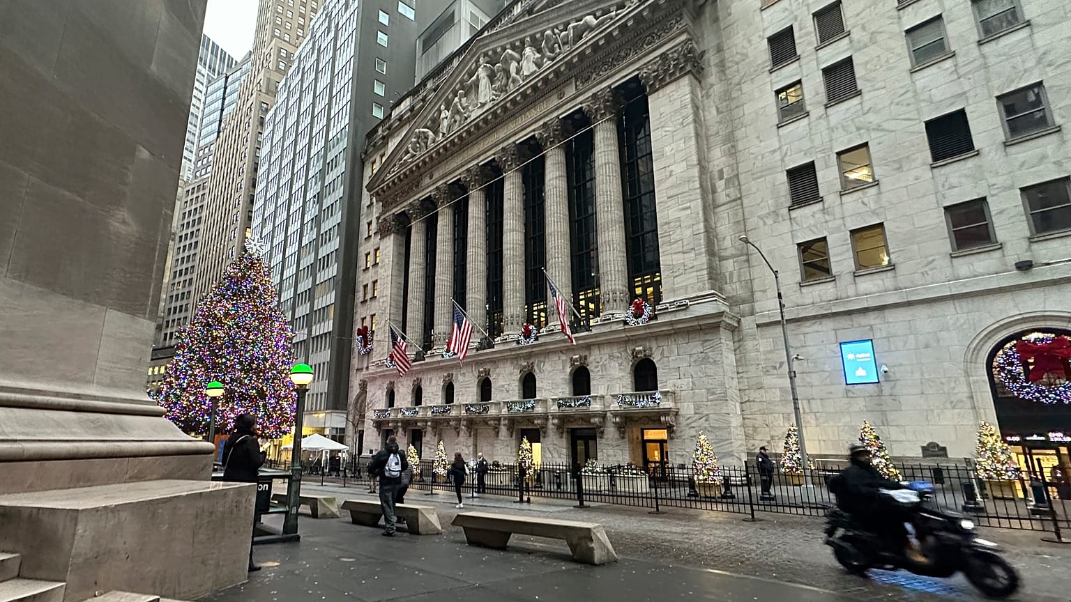 A scooter passes the New York Stock Exchange in New York's Financial District on Tuesday, Dec. 17, 2024.