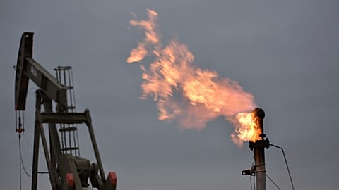 A flare for burning excess methane, or natural gas, from crude oil production at a well pad at North Dakota in the US
