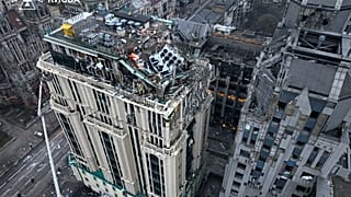 n this photo provided by the Ukrainian Emergency Service, firefighters work on the site of a damaged building after a Russian missile attack in Kyiv, Ukraine, Friday, Dec. 20,