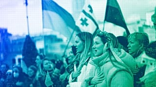 Members of the Ukrainian community sing their national anthem as they take part in a protest against the Russian invasion of Ukraine, March 2022