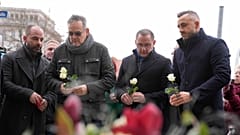 Leader of AfD party Tino Chrupalla pays tribute to victims outside St. John's Church in Magdeburg.