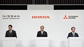 Nissan Chief Executive Makoto Uchida, left, Honda Chief Executive Toshihiro Mibe, center, and Takao Kato, CEO of Mitsubishi Motors, right, attend a joint news conference in To