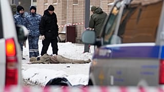 Investigators work the site where Igor Kirillov was killed by a bomb hidden in a scooter outside his apartment building in Moscow, 17 December, 2024