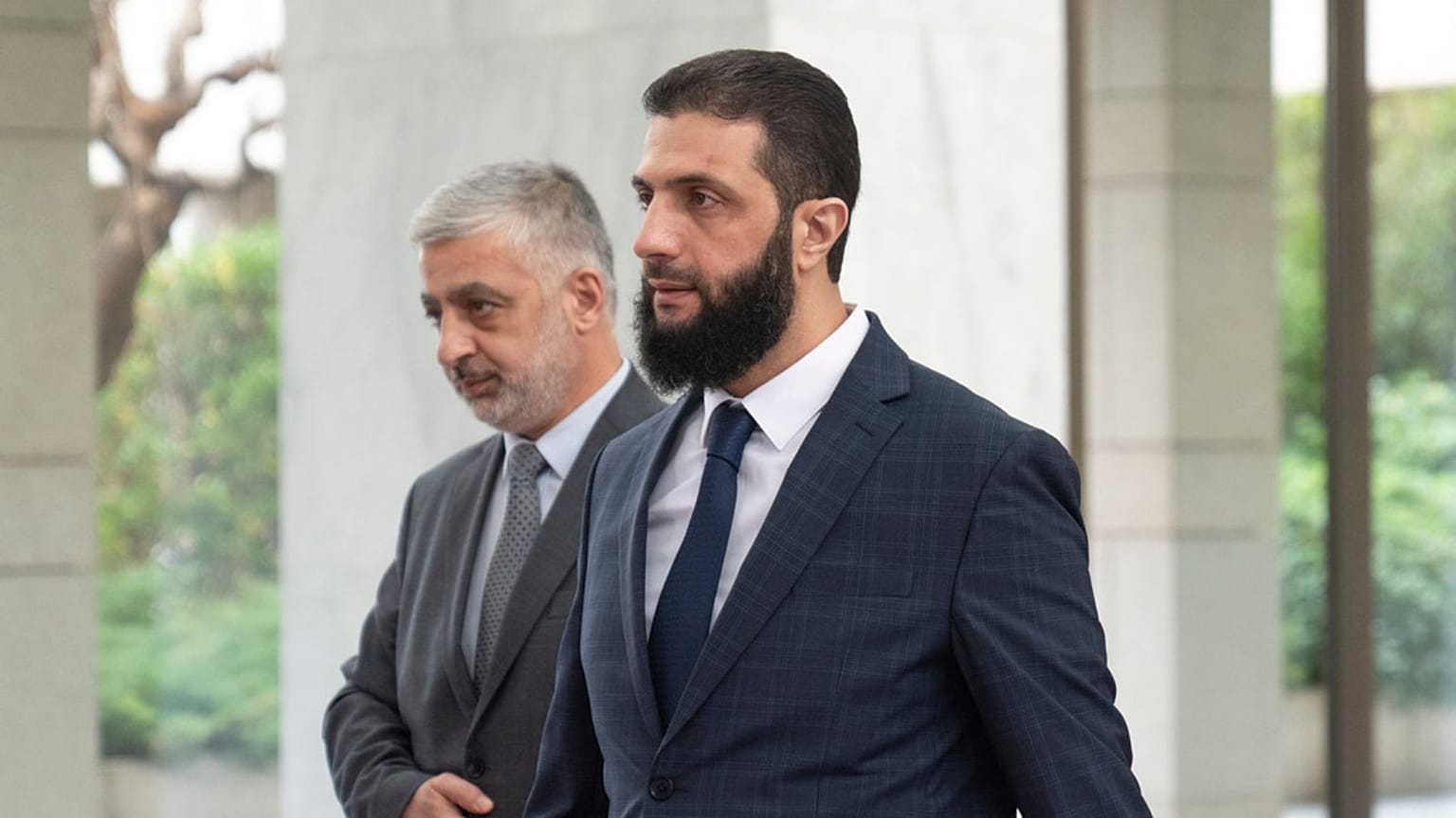 Syria's de facto leader Ahmad al-Sharaa, foreground, formerly known as Abu Mohammed al-Golani