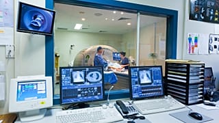 A patient gets a body scan at a hospital.