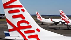 ARCHIVO: Aviones de Virgin Australia estacionados en la terminal del aeropuerto de Sídney, en Sídney, el miércoles 5 de agosto de 2020.