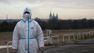 A person in a protective suit is shown in Prague, Czech Republic, in September 2020 amid the COVID-19 pandemic.