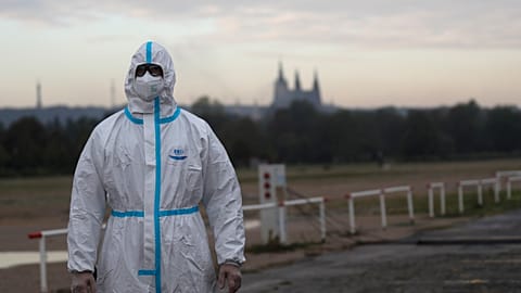 A person in a protective suit is shown in Prague, Czech Republic, in September 2020 amid the COVID-19 pandemic.