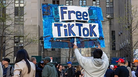 FILE - A man carries a Free TikTok sign in front of the courthouse where the hush-money trial of Donald Trump was underway on April 15, 2024, in New York.