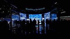 People look at a display of Samsung screens and products at the CES tech show Tuesday, January 7, 2025, in Las Vegas.