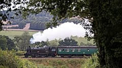 The British Railways Ivatt Class 2MT Tank Engine number 41312, makes its way along the Mid Hants railway, near to Ropley, England, August 2020. 