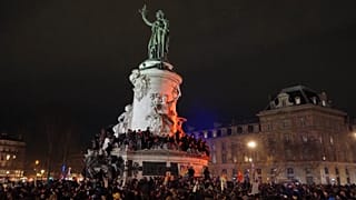 Left-leaning demonstrators celebrate the death of Jean-Marie Le Pen in Paris