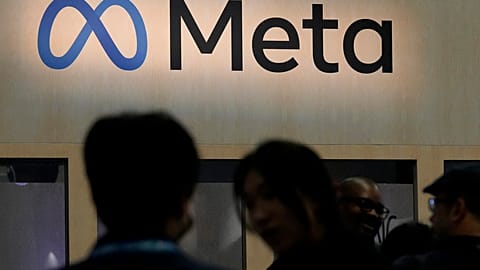 Attendees visit the Meta booth at the Game Developers Conference in San Francisco on March 22, 2023.