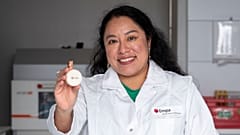 Empa scientist Carolina Reyes with the fungal battery that is encased in beeswax. 