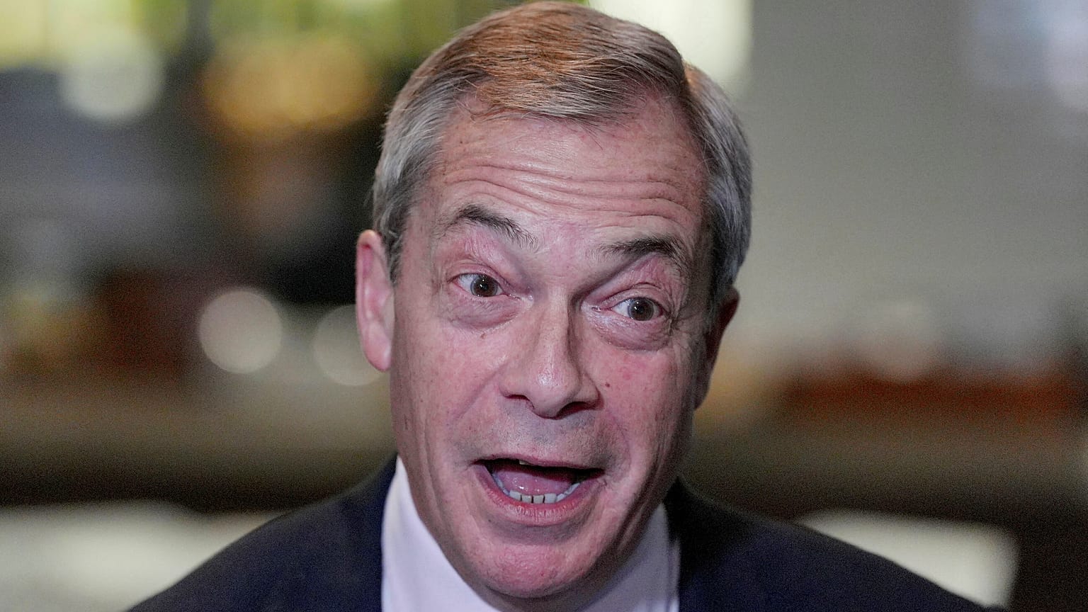 Reform UK leader Nigel Farage speaks at Sandown Park Racecourse in Esher, England, on 10 January, 2025. 