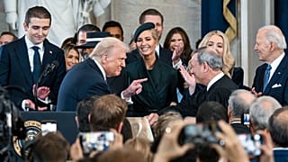 President Donald Trump points to Supreme Court Chief Justice John Roberts