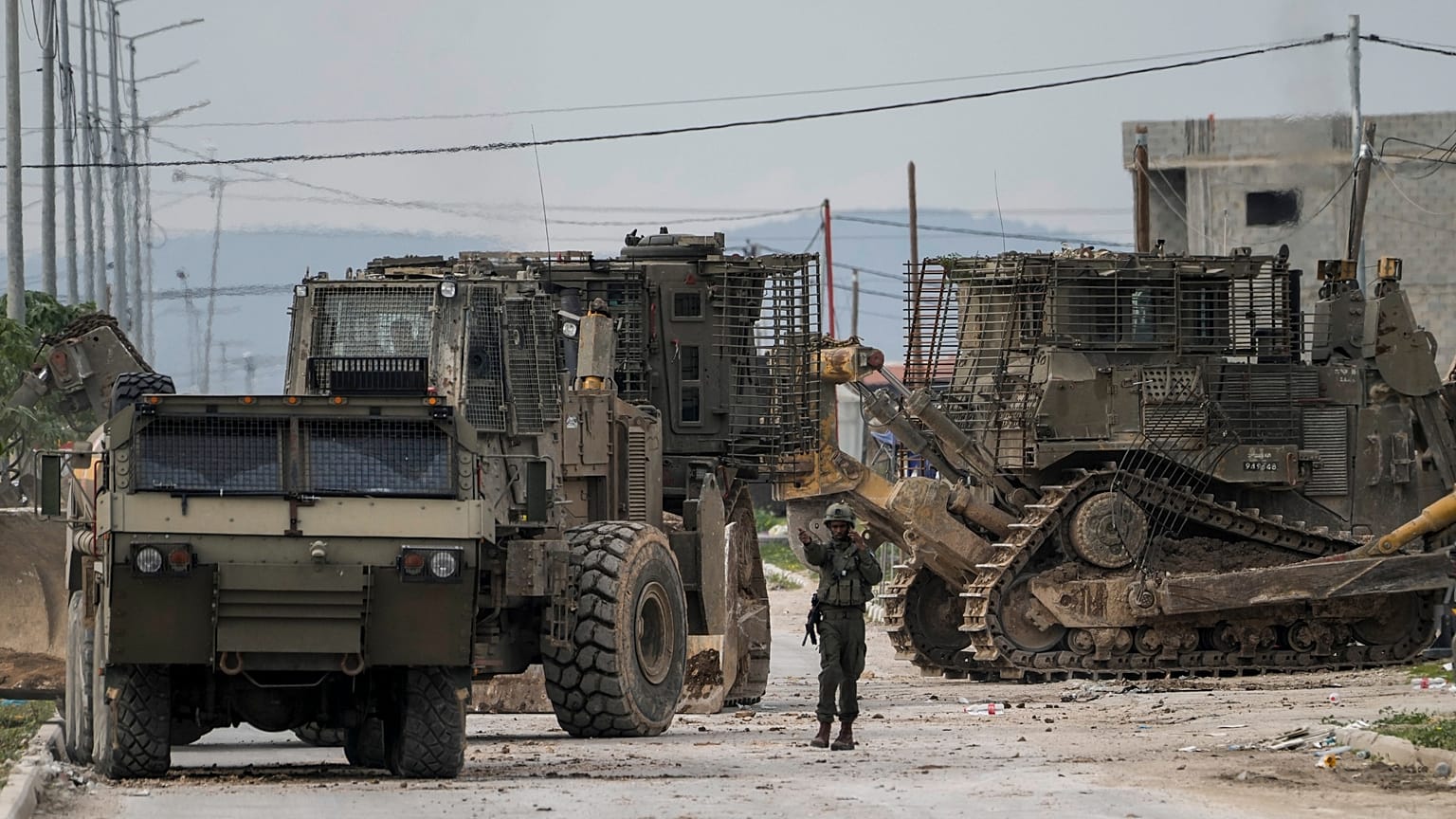 Israeli army vehicles take part in a military operation in the West Bank city of Jenin.