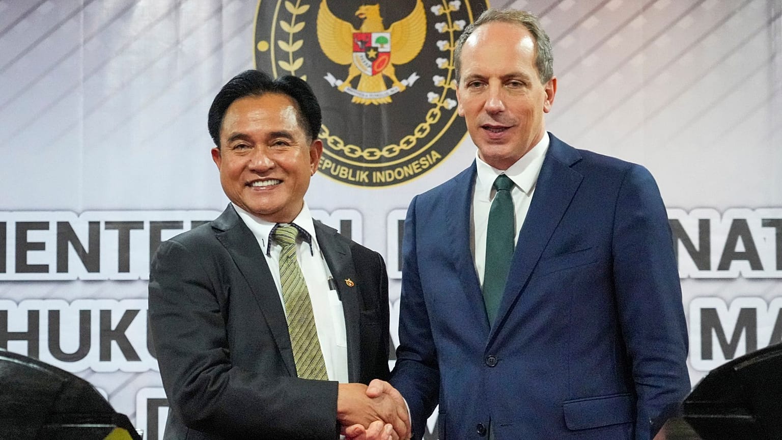 France's Ambassador to Indonesia Fabien Penone, right, talks with Indonesia's Coordinating Minister Yusril Ihza Mahendra during a press conference, 24 January 2025.