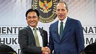 France's Ambassador to Indonesia Fabien Penone, right, talks with Indonesia's Coordinating Minister Yusril Ihza Mahendra during a press conference, 24 January 2025.