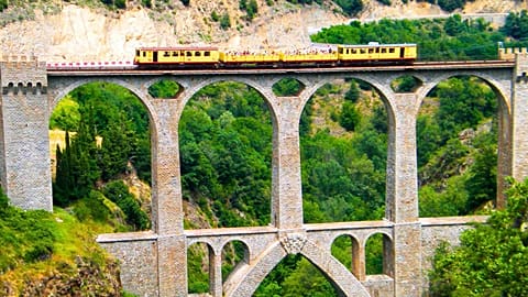 Running between Villefranche-de-Conflent and Latour-de-Carol in the Catalan region, France’s Le Petit Train Jaune offers a Wes Anderson style journey