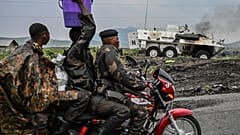 A UN armoured personnel carrier burns during clashes with M23 rebels outside Goma, Democratic Republic of the Congo, Saturday, Jan. 25, 2025. (AP Photo/Moses Sawasawa)