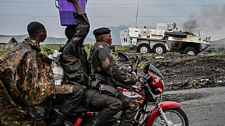 A UN armoured personnel carrier burns during clashes with M23 rebels outside Goma, Democratic Republic of the Congo, Saturday, Jan. 25, 2025. (AP Photo/Moses Sawasawa)