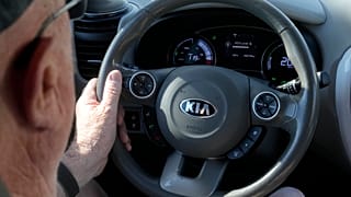 A Kia electric vehicle is driven