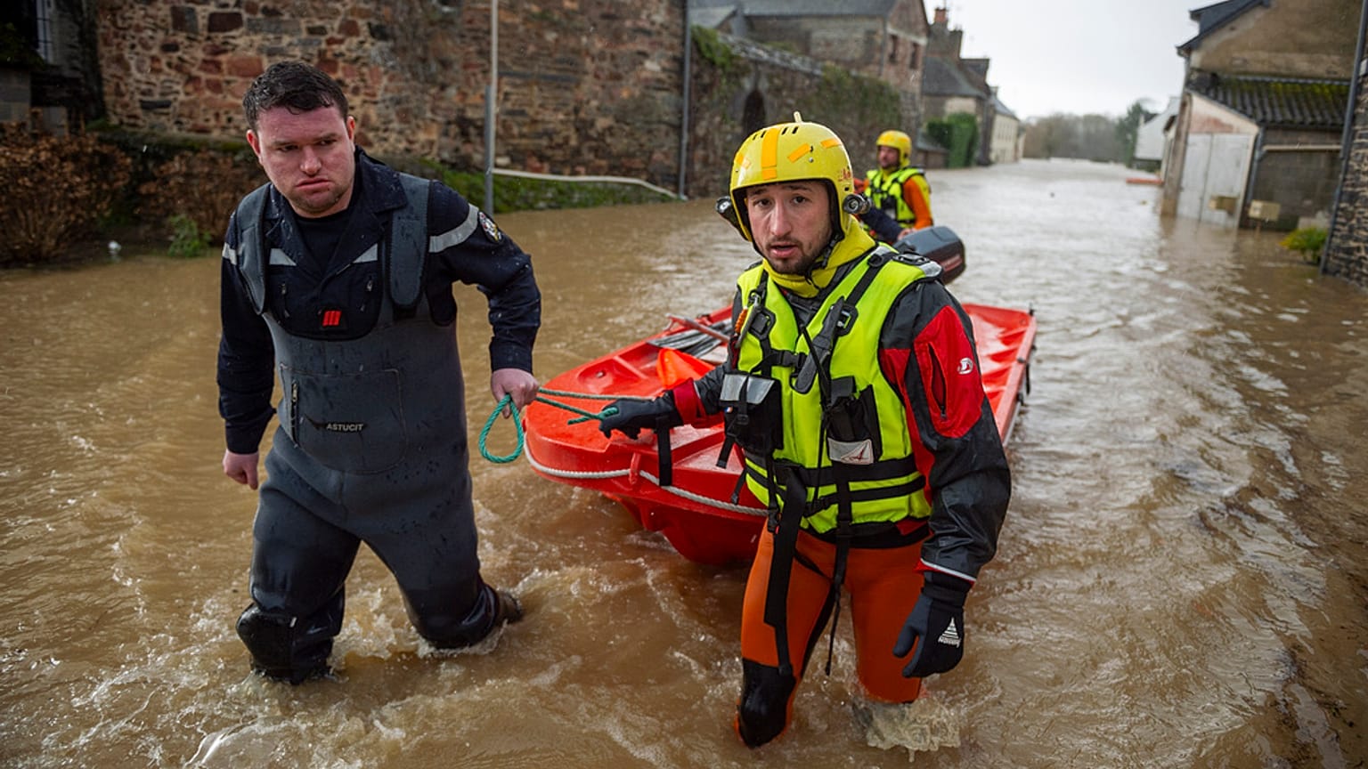 Rescue workers pull a small boat after storm Herminia has unleashed downpours on the region, Monday, Jan. 27, 2025 in in the village of Guipry Messac, western France.