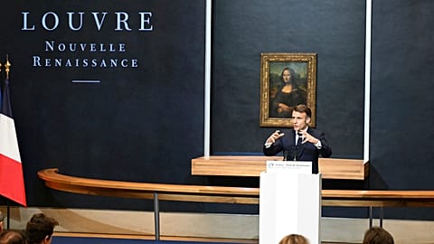 French President Emmanuel Macron gives a speech to announce a multi-year overhaul, long-term investments to modernize the Louvre museum