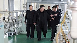 In this undated photo provided Wednesday, Jan. 29, 2025, by the North Korean government, Kim Jong Un, second right, inspects a facility that produces nuclear material