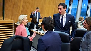 Commission president Ursula von der Leyen jokes with climate commissioner Wopke Hoekstra and voice-president Teresa Ribera, whose portfolio include competitiveness, 29 January