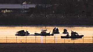 Search and rescue efforts are seen around a wreckage site in the Potomac River from Ronald Reagan Washington National Airport, 30 January 2025