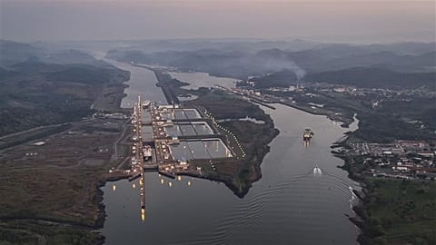 A ship travels through Miraflores locks on the Panama Canal