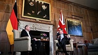 Britain's Prime Minister Keir Starmer, right, speaks with Germany's Chancellor Olaf Scholz during their bilateral meeting at the Chequers, in Aylesbury, England, Sun, Feb.25