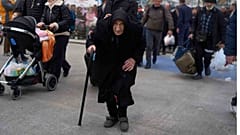 Flora Karamolegou, 94, boards a ferry bound for the Greek mainland, Santorini, 4 February 2025