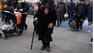 Flora Karamolegou, 94, boards a ferry bound for the Greek mainland, Santorini, 4 February 2025