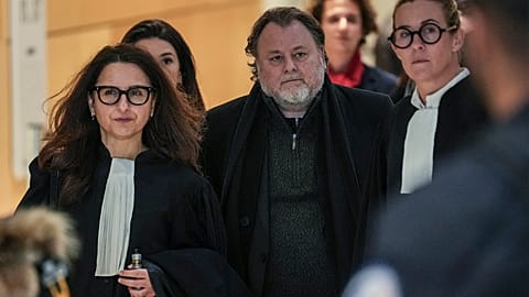 French filmmaker Christophe Ruggia arrives with his legal team at courthouse in Paris, Monday, Feb. 3, 2025