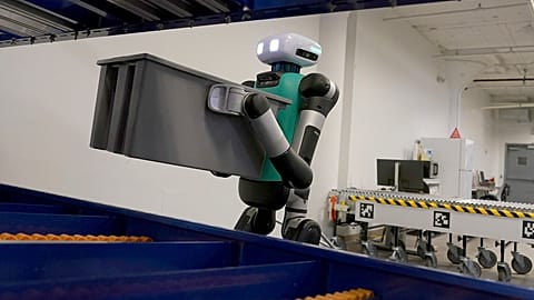 A warehouse Agility Robotics' warehouse robot Digit performs manoeuvres at the company's office in Pittsburgh. places packages on a robot.