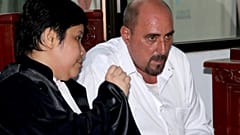FILE - Serge Atlaoui talks with his lawyer Nancy Yuliana for his judicial review hearing at the district court in Tangerang, Indonesia Wednesday, 1 April 2015. 