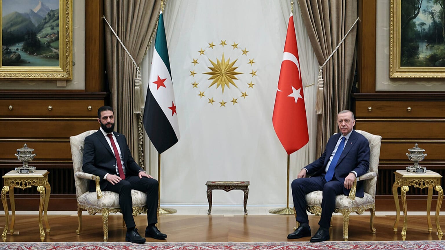 Turkish President Recep Tayyip Erdogan sits next to Syria's interim President Ahmad al-Sharaa during meeting at the presidential palace in Ankara, Turkey, Tuesday Feb. 4, 2025