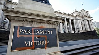 FILE: A Nazi swastika is seen graffitied on the front of the Victorian State Parliament in Melbourne, Australia, Monday, Oct. 1, 2012.